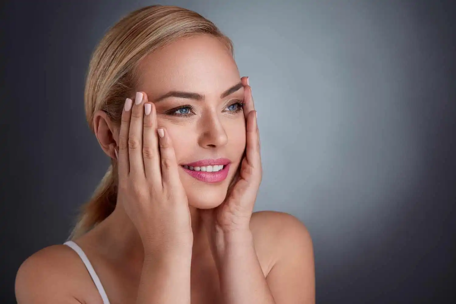 Woman with smooth, youthful-looking skin illustrating skin tightening treatment results